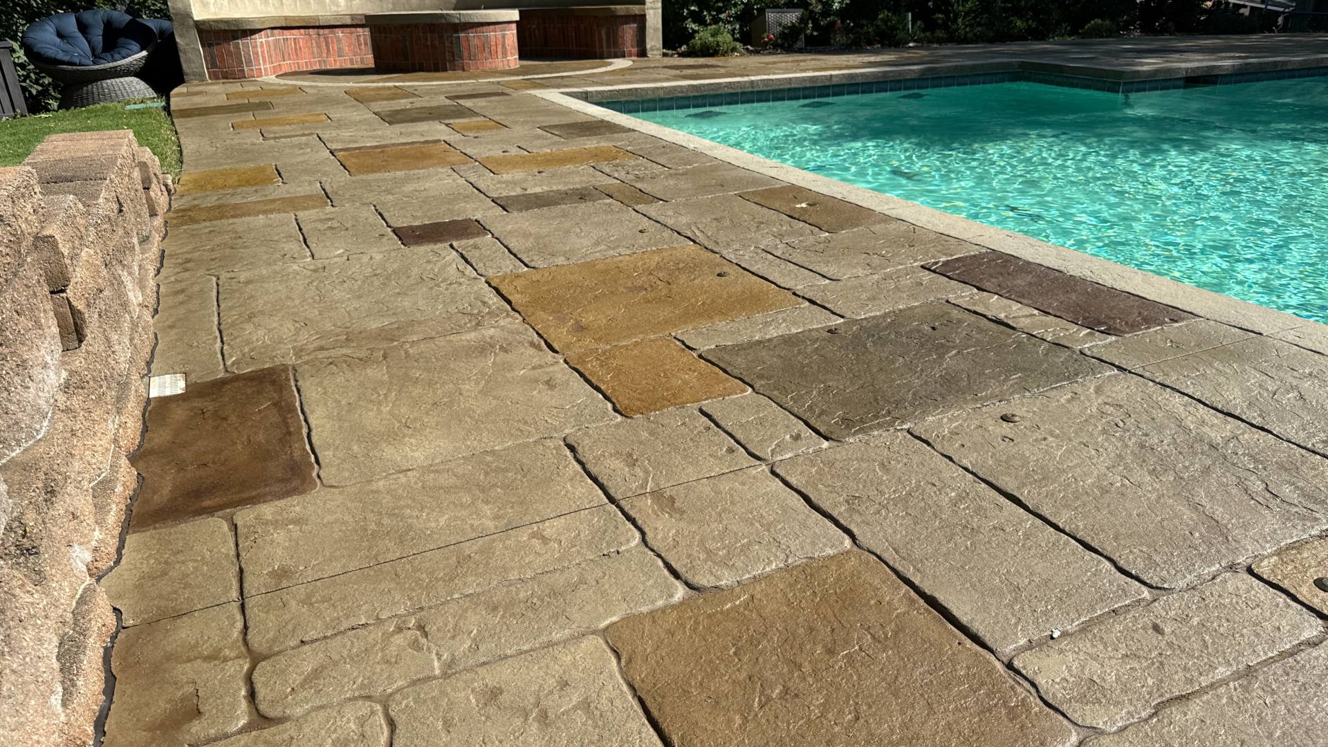 Scofield Lithochrome color hardener on decorative stained concrete